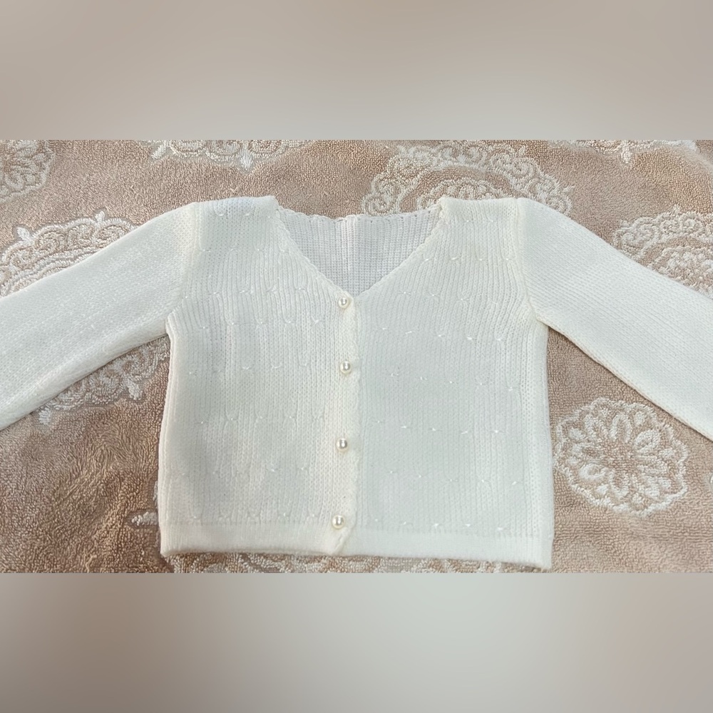 Adorable infant 0-3 months white knit sweater with pearl buttons and stitching